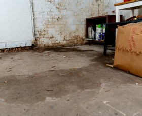 wet concrete floor with standing water
