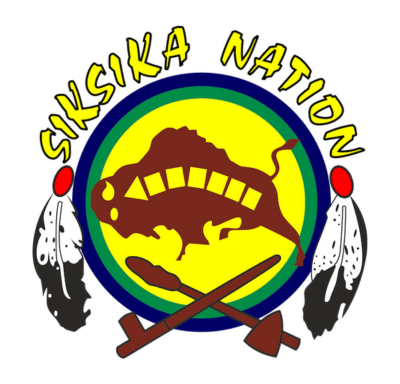 Siksika Nation logo with a buffalo, feathers, and two crossed tools on a yellow and green circle.